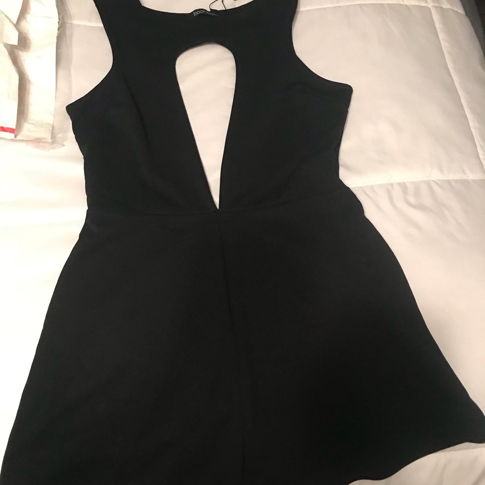 Boohoo black romper. Low V neckline. Size 6 US.